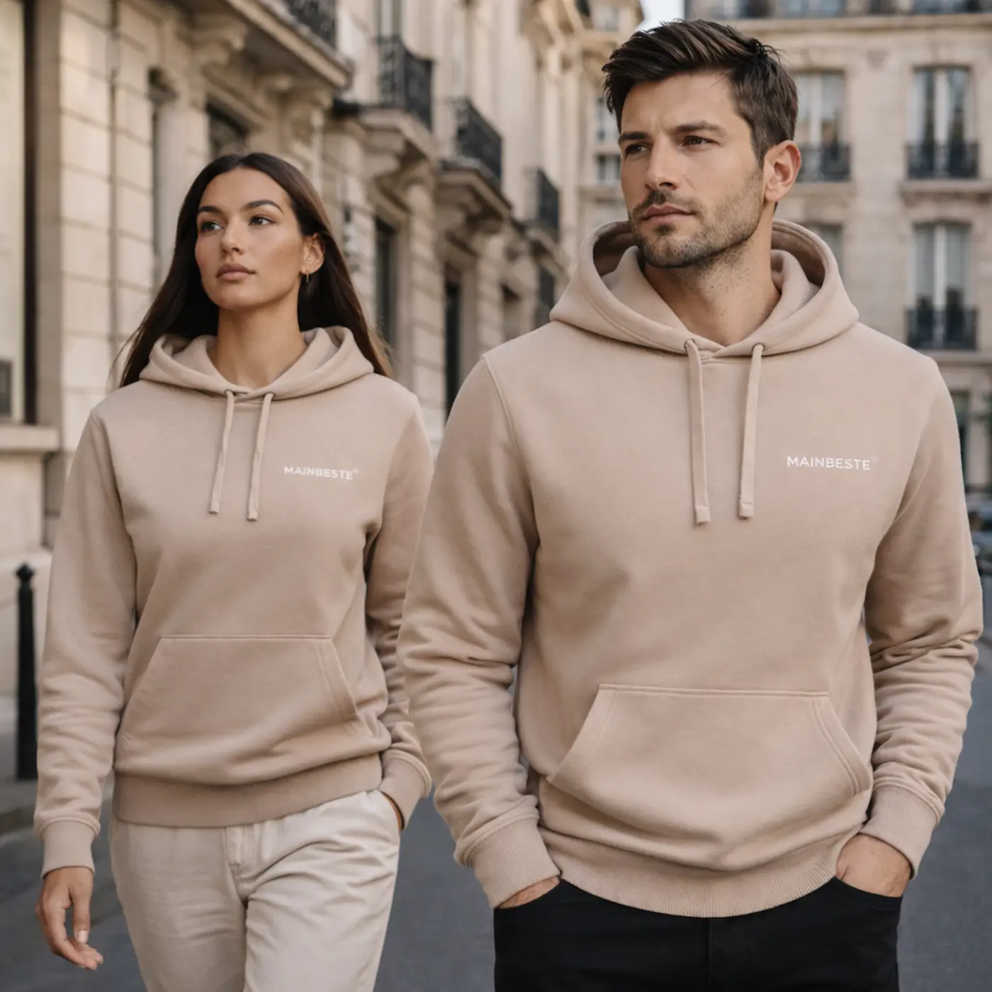 Couple wearing Mainbeste Sand Gold hoodies in Paris